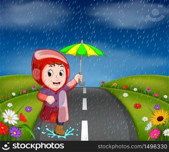 boys in raincoat running on road