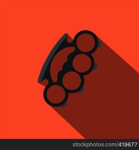 Brass knuckles flat icon on a russet background. Brass knuckles flat