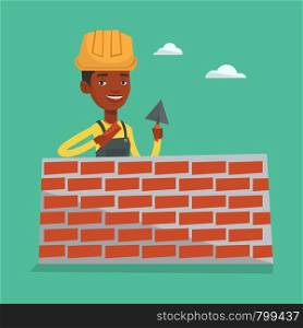 Bricklayer in uniform and hard hat. An african-american bicklayer working with spatula and brick on construction site. Bricklayer building brick wall. Vector flat design illustration. Square layout.. Bricklayer working with spatula and brick.