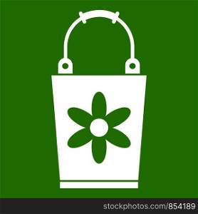 Bucket icon white isolated on green background. Vector illustration. Bucket icon green
