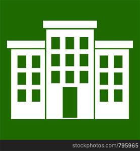 Building icon white isolated on green background. Vector illustration. Building icon green