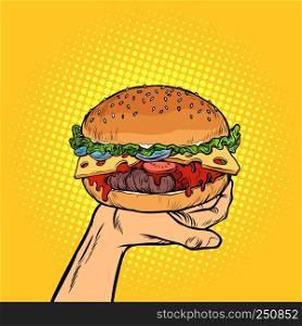 Burger on hand. fast food. Pop art retro vector illustration vintage kitsch. Burger on hand. fast food