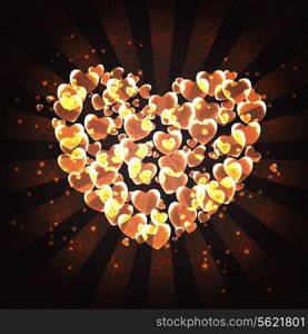 burning heart with sparkles on a dark background