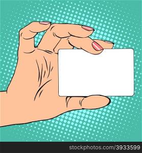 Business card or credit card in female hand pop art retro style. Business or credit card in female hand