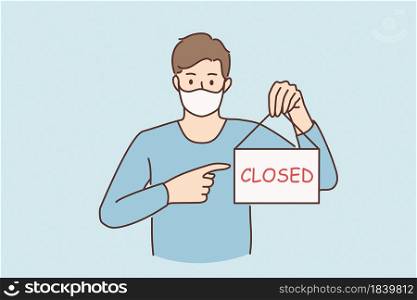 Business crisis during pandemic concept. Young sad man in protective medical mask standing showing sign with closed word during covid epidemic concept vector illustration . Business crisis during pandemic concept.