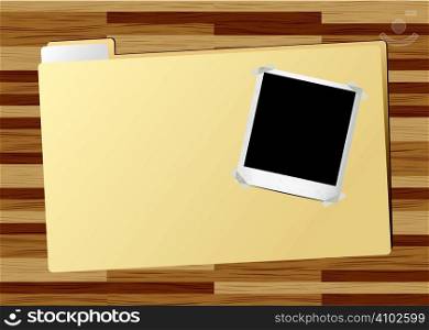 Business folder with instant photograph on a wooden desk