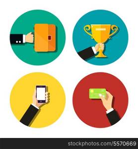 Business hand holding items flat icons set with mobile smartphone trophy cup credit card and briefcase with documents isolated vector illustration