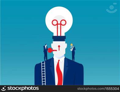 Business man in a suit holding a light bulb on top head human chang idea concept