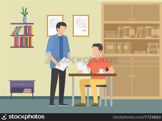 Business meeting or working process in office interior. Male boss sitting at a table reading document, talking to manager. Project management and teamwork concept. Businessmen make a financial report. Boss sitting at a table reading document, talking to manager. Businessmen make a financial report