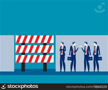Business people discuss in front of dead end sign board