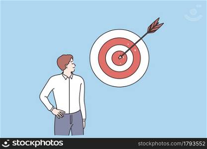 Business success, achieving goal, leadership concept. Young smiling businessman cartoon character standing looking at darts game with reached center arrow vector illustration . Business success, achieving goal, leadership concept
