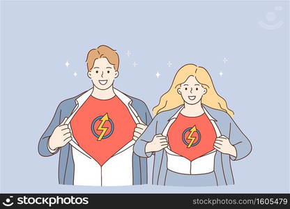 Business team and successful cooperation concept. Young man and woman business people partners standing together and showing superman sign on chests meaning strength of union. Business team and successful cooperation concept