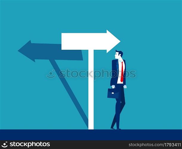 Businessman confused with the direction of the arrow sign. The arrow shadow in opposite direction