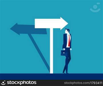 Businessman confused with the direction of the arrow sign. The arrow shadow in opposite direction