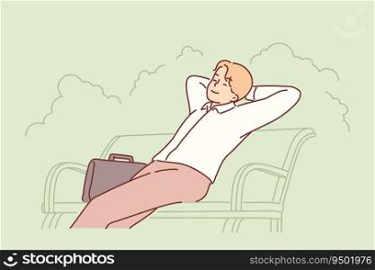 Businessman sits on park bench with eyes closed and enjoys outdoor recreation. Businessman or company manager with happy face relaxing on street during lunch break or after end of working day. Happy businessman sits on park bench with eyes closed and enjoys outdoor recreation