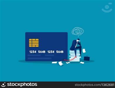 businessman stress debt with foot chained to bank credit card trying to escape.