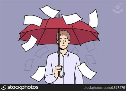 Businessman suffering from bureaucracy standing with umbrella among falling documents symbolizing overabundance of paperwork. Business concept of inefficiency in corporation due to bureaucracy. Businessman suffering from bureaucracy standing with umbrella among falling documents