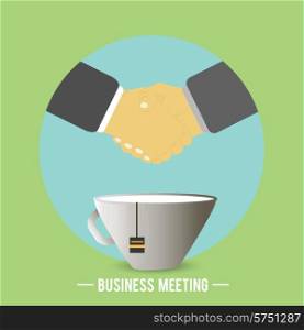 Businessmen have agreed on business meeting and there is a handshake behind a cup of tea, coffee. Business concept
