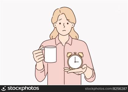 Businesswoman with alarm clock and cup of coffee offers to take break from work and cheer up to improve productivity. Tired woman manager invites you to drink coffee or hot tea and relax . Businesswoman with alarm clock and cup of coffee offers to take break from work and cheer up 