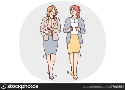 Businesswomen walking together talking discussing business ideas. Female employees with documents or paperwork in hands walk chatting. Vector illustration.. Businesswomen walk talking in office