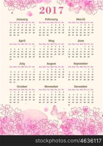 Calendar for 2017 year. Abstract background with pink watercolor blots, flowers and butterflies.