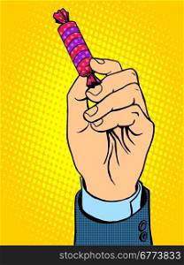 Candy in hand pop art retro style. Food sweets bait. Candy in hand