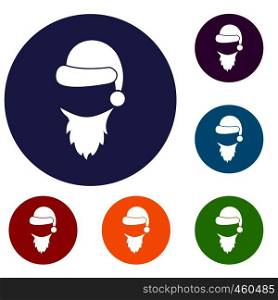 Cap with pompon of Santa Claus and beard icons set in flat circle reb, blue and green color for web. Cap with pompon of Santa Claus and beard icons set