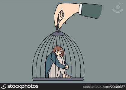 Captivity slavery and freedom concept. Young sad depressed woman sitting in cage which is held by huge human hand manipulating it vector illustration . Captivity slavery and freedom concept