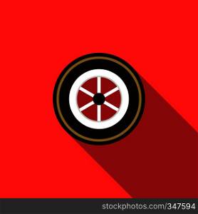 Car wheel icon in flat style on a red background. Car wheel icon in flat style