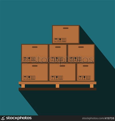 Cardboard boxes on wooden palette flat icon on a blue background. Cardboard boxes on wooden palette flat