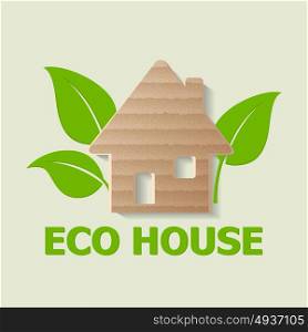 Cardboard house and green leaves. Ecology concept.