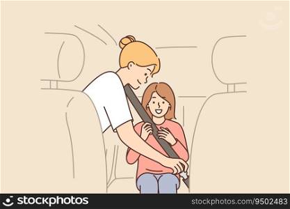 Caring mother uses child seatbelt to fasten little girl into passenger seat of car. Ensuring safety when transporting children and using seatbelt that protects against injury in accident. Caring mother uses child seatbelt to fasten little girl into passenger seat of car.