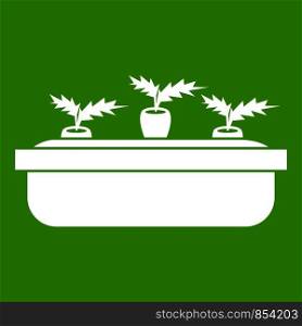 Carrots in a wooden pot icon white isolated on green background. Vector illustration. Carrots in a wooden pot icon green