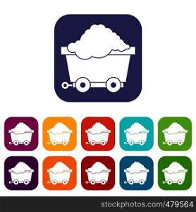 Cart on wheels with coal icons set vector illustration in flat style in colors red, blue, green, and other. Cart on wheels with coal icons set