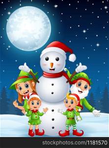 Cartoon christmas elves with snowman in the winter night background