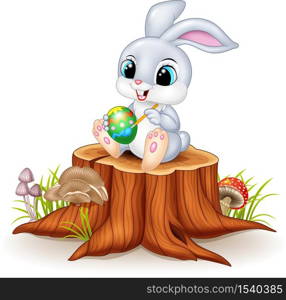 Cartoon Easter Bunny painting an egg on tree stump