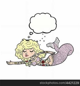 cartoon mermaid covered in tattoos with thought bubble