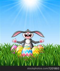 Cartoon rabbit laughing with easter eggs in the grass
