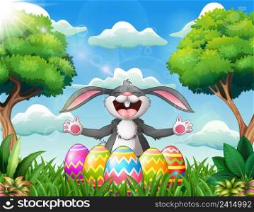 Cartoon rabbit laughing with five decorated easter eggs in the park 