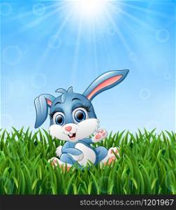 Cartoon rabbit sitting in the grass on a background of bright sunshine