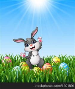 Cartoon rabbit with easter eggs in the grass