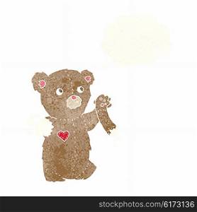 cartoon teddy bear with torn arm with thought bubble