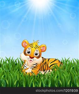 Cartoon tiger lay down in the grass on a background of bright sunshine