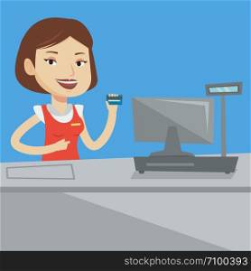 Cashier holding credit card at the checkout in supermarket. Happy cashier working at checkout in a supermarket. Cashier standing near the cash register. Vector flat design illustration. Square layout.. Cashier holding credit card at the checkout.
