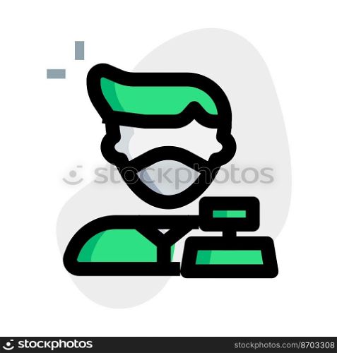 Cashier on cash counter with machine and mask.