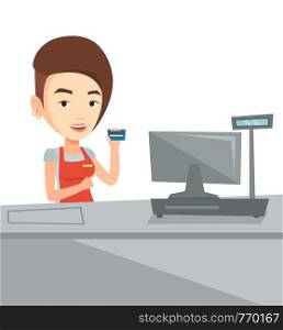 Caucasian cashier standing at the checkout in supermarket and showing credit card. Happy cashier working at the checkout in a supermarket. Vector flat design illustration isolated on white background.. Cashier holding credit card at the checkout.