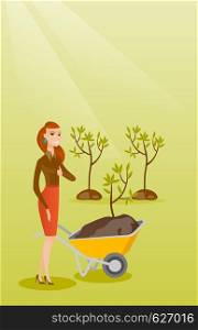 Caucasian female gardener with wheelbarrow on the background of newly planted trees. Young gardener pushing wheelbarrow with tree and dirt in the park. Vector flat design illustration. Vertical layout. Woman pushing wheelbarrow with plant.