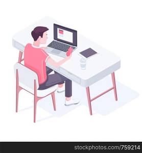 Caucasian white man sitting at the desk in modern office. Office worker surrounded by modern devices, such as laptop, tablet and smartphone. Vector cartoon isometric illustration on white background.. Young caucasian man working in modern office.