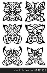 Celtic tattoos of graceful black butterflies with ornamental wings, composed from traditional scandinavian knot patterns. Isolated background. Celtic tattoos of black butterflies