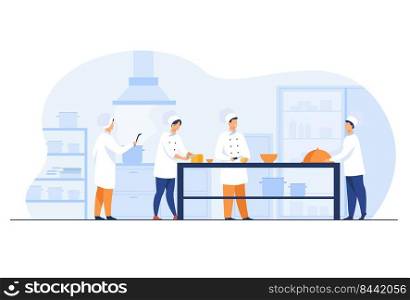 Chefs, cooks and waiters working at restaurant kitchen isolated flat vector illustration. Cartoon professional and commercial cooking process. Hospitality and food concept